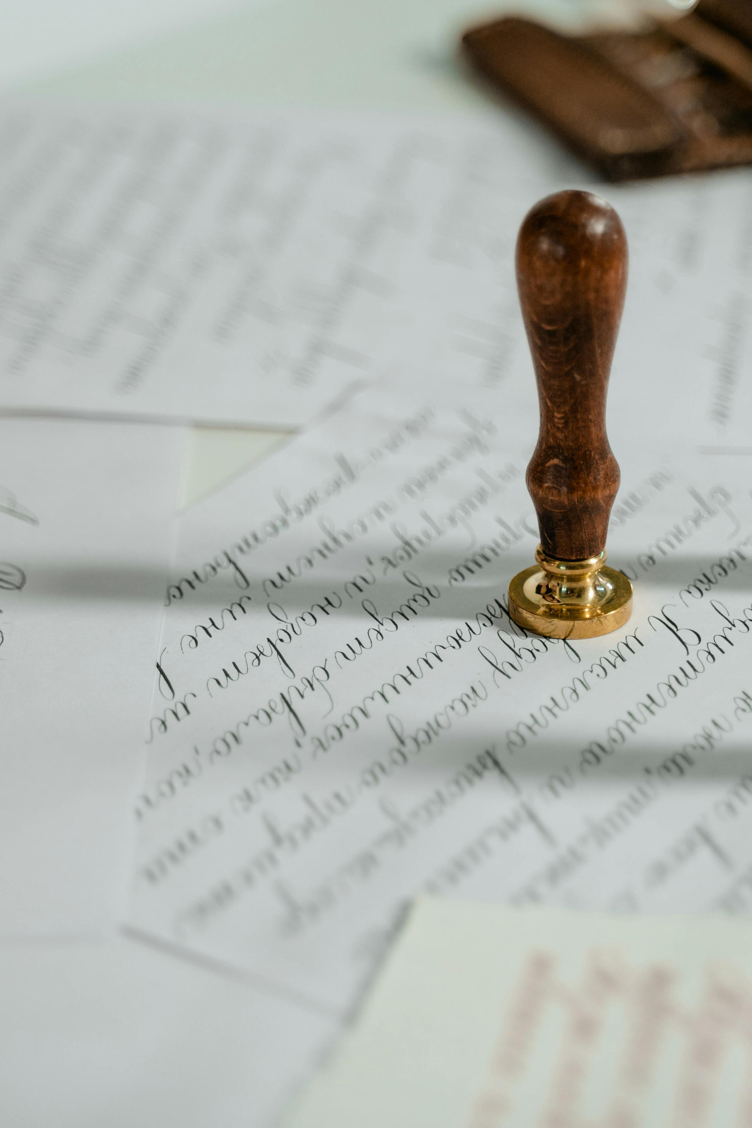 MART PRODUCTION "Vintage calligraphy papers with a wooden wax seal stamp, embodying timeless elegance." by MART PRODUCTION